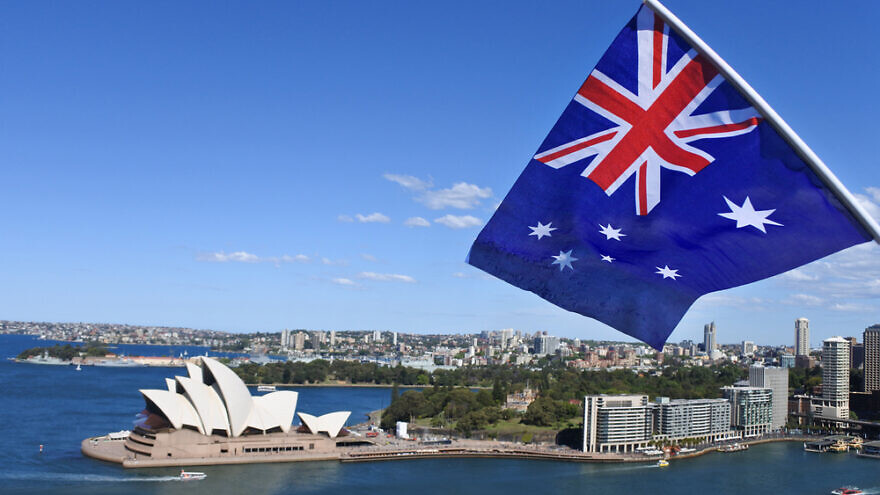 The,National,Flag,Of,Australia,Flies,Above,Sydney,Harbor,And